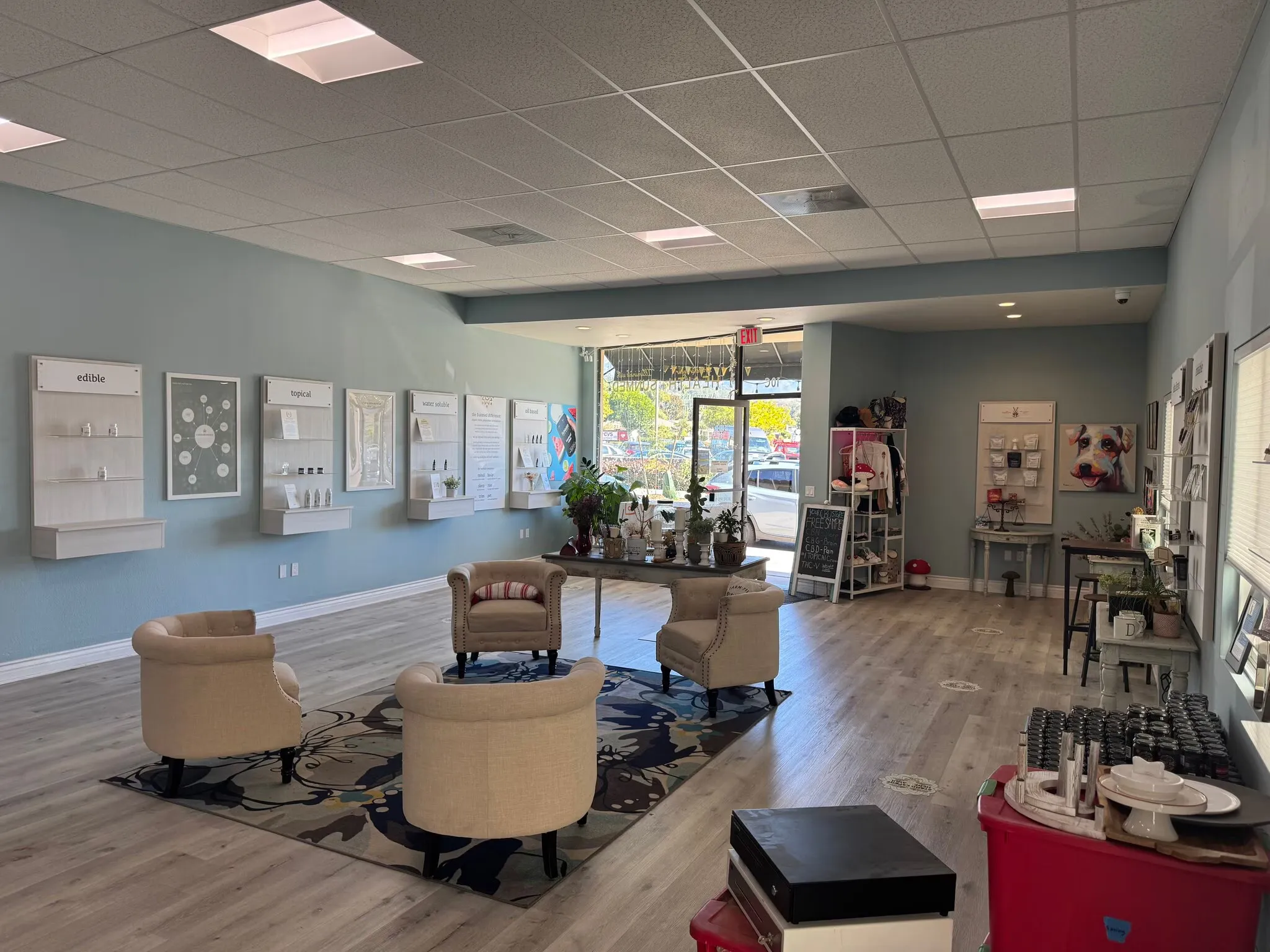 Inside the 1,200 SF retail space — open floor plan with hardwood floors, recessed lighting and a full-width storefront window.